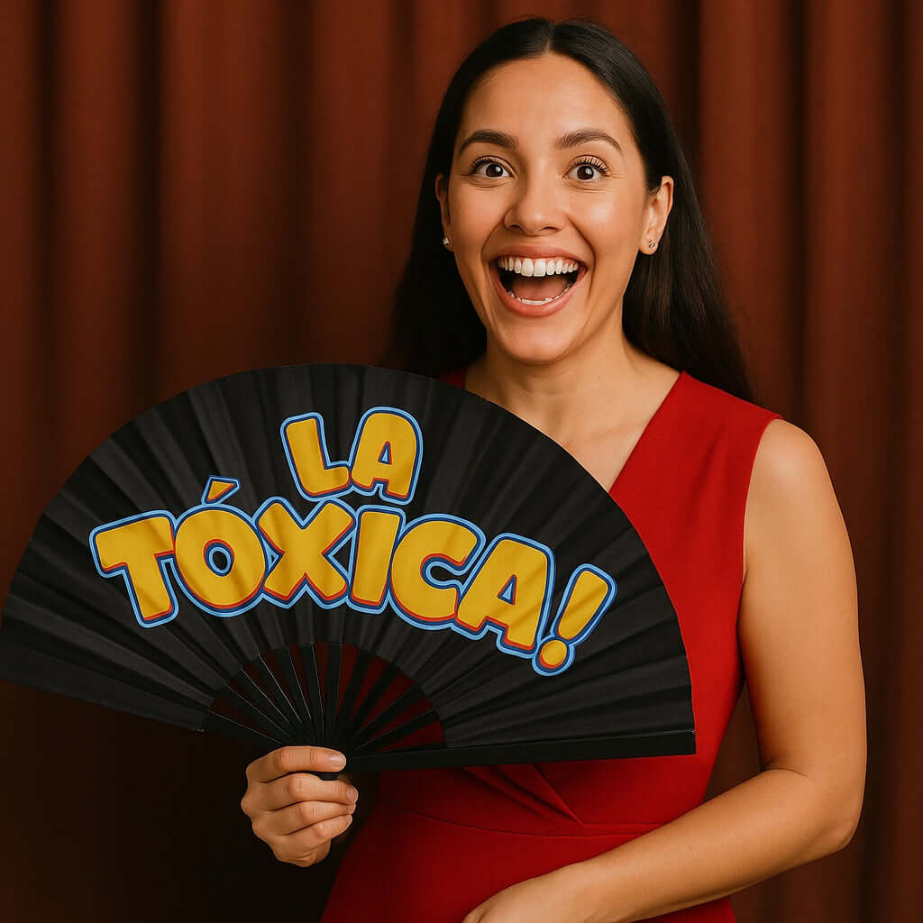 Colorful 13" folding fan with 'La Toxica!' text, perfect prop to add fun to events, held by a smiling woman in a red dress.