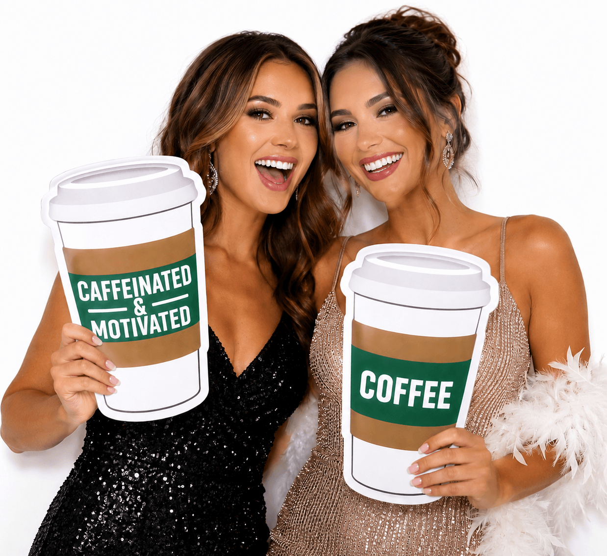 Two women happily posing with Coffee Cup PVC Photo Booth Prop 12 Inch Double Sided at an event.