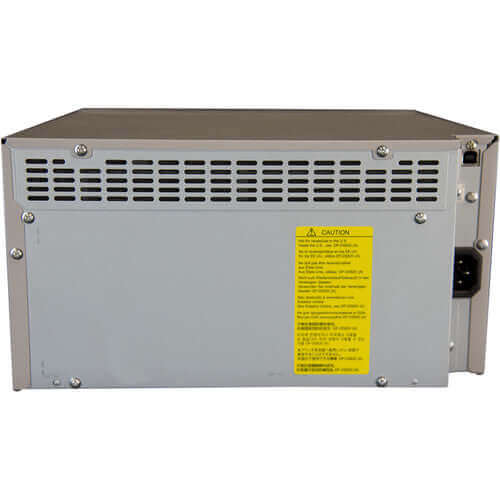 Back view of a compact photo printer showing ventilation and caution label.