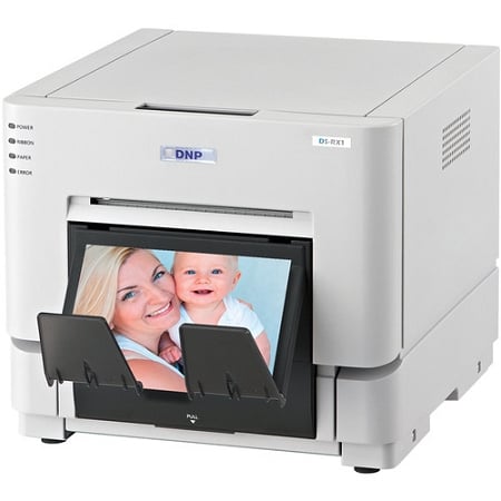 DNP DS-RX1HS photo printer showcasing a print of a mother and baby, ideal for event and photo booth use.