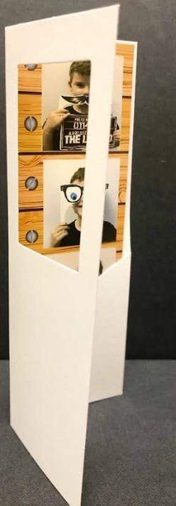 2 x 6 inch white photo booth strip folder with window showcasing fun photo prints.