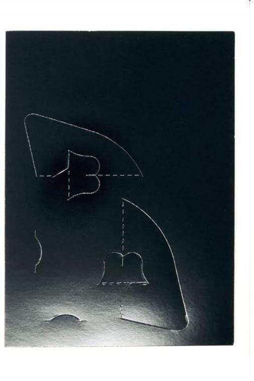 Glossy black cardboard photo easel template with cut-out design for 4x6 photos, ready to assemble.