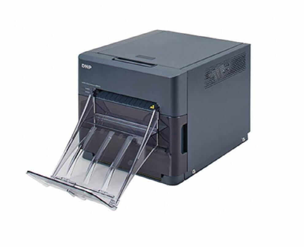 DNP QW410 Photo Printer with paper output tray extended, showcasing ultra-compact design.