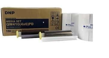 DNP QW410PD2S perforated media kit for photo booths, including paper and ribbon rolls in box.