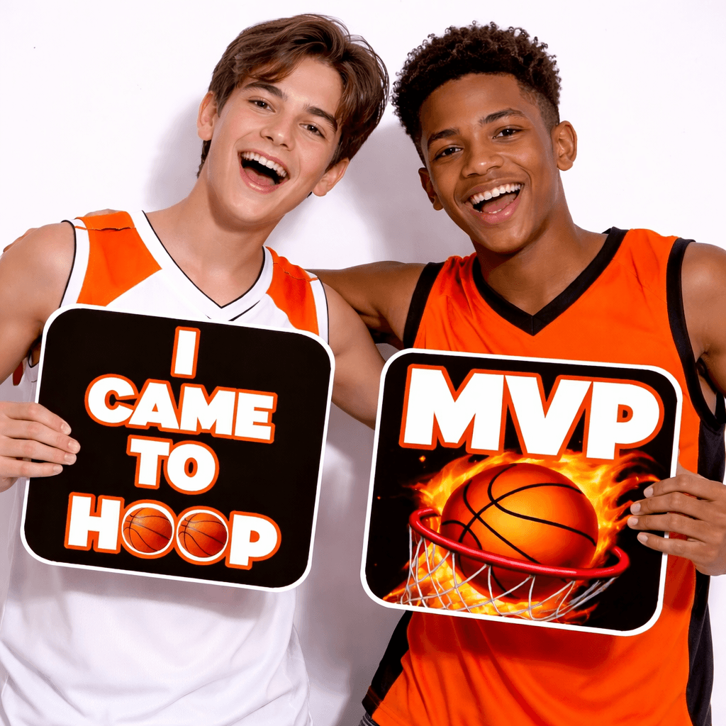 Two young men holding colorful photo booth props for Basketball Prop Set, expressing excitement with fun phrases.